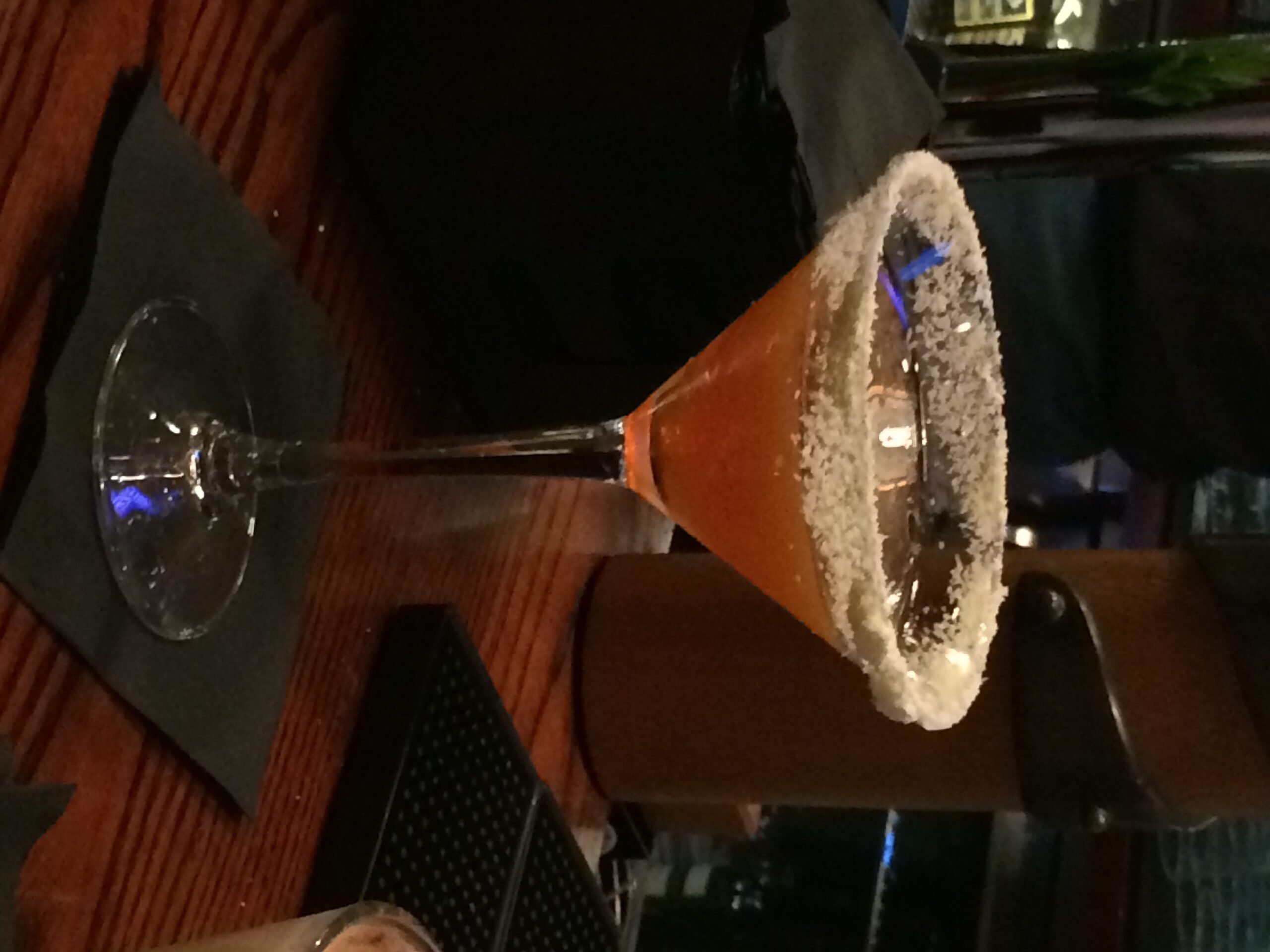 a glass with a drink in it