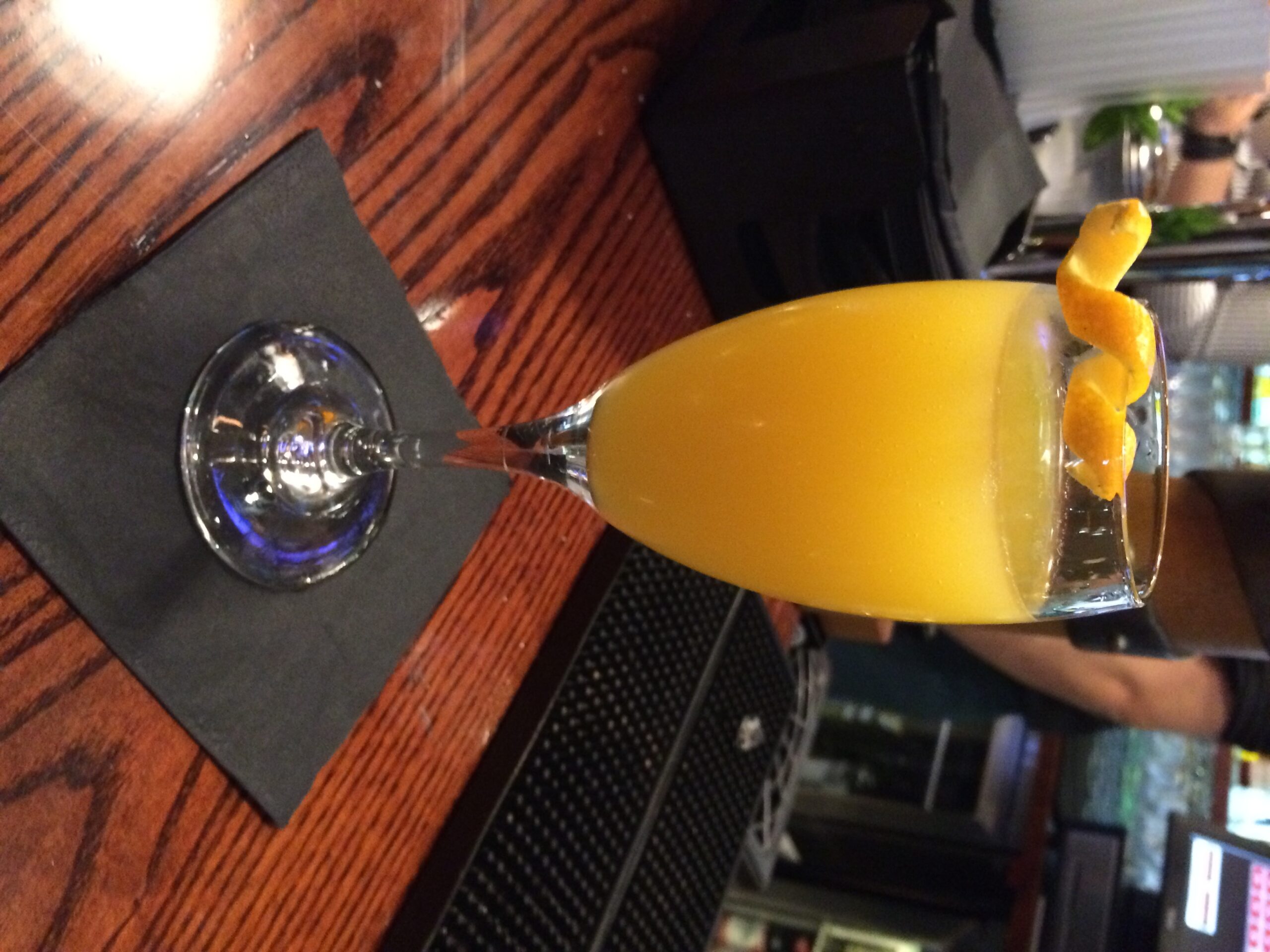 a glass of orange juice on a table