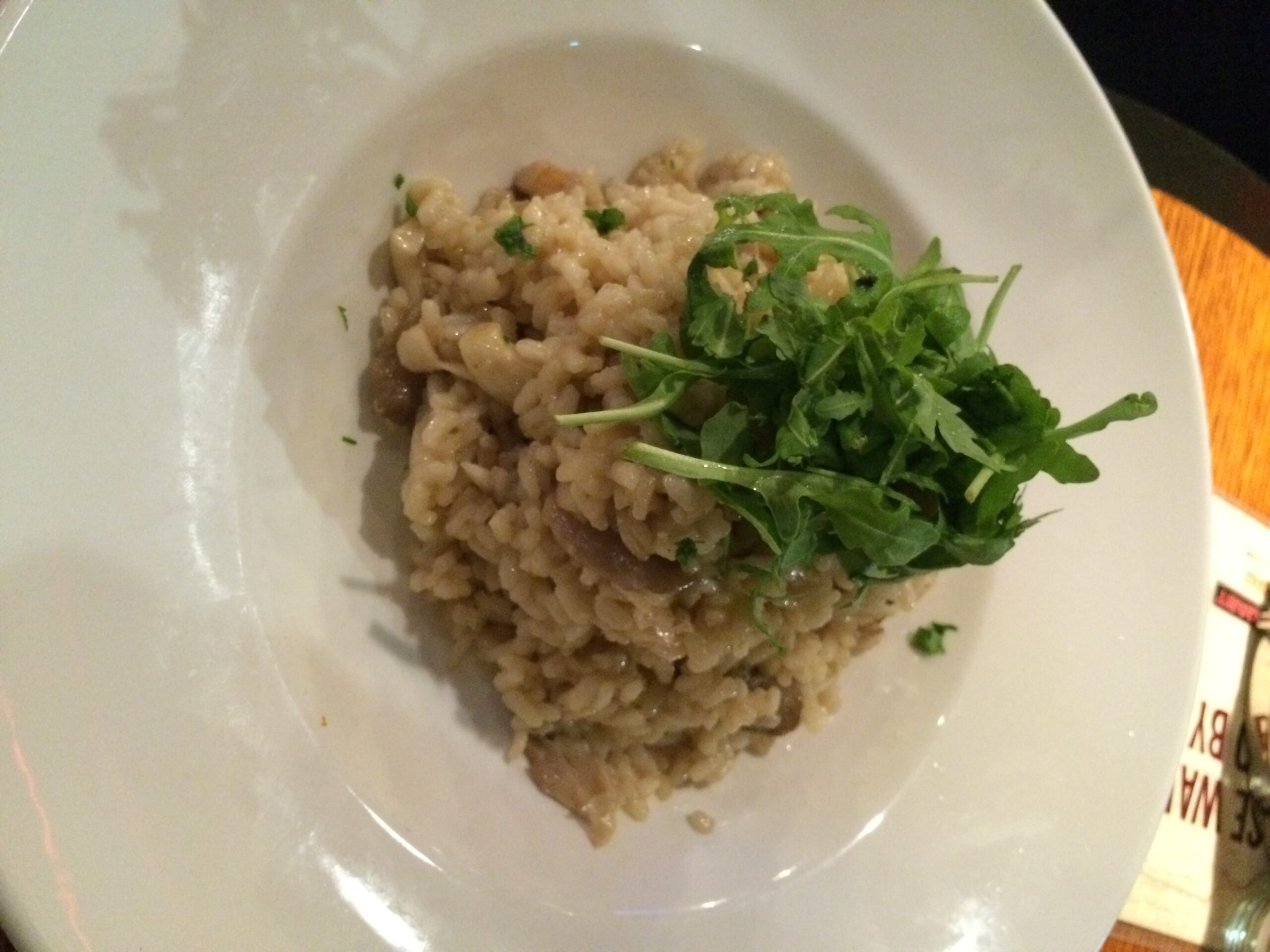 a plate of food with greens on it