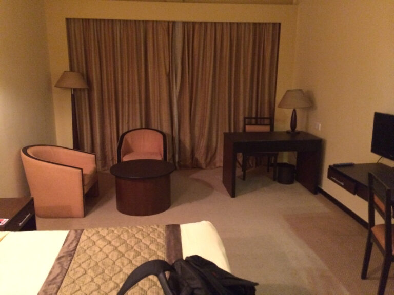 a room with a bed and a chair