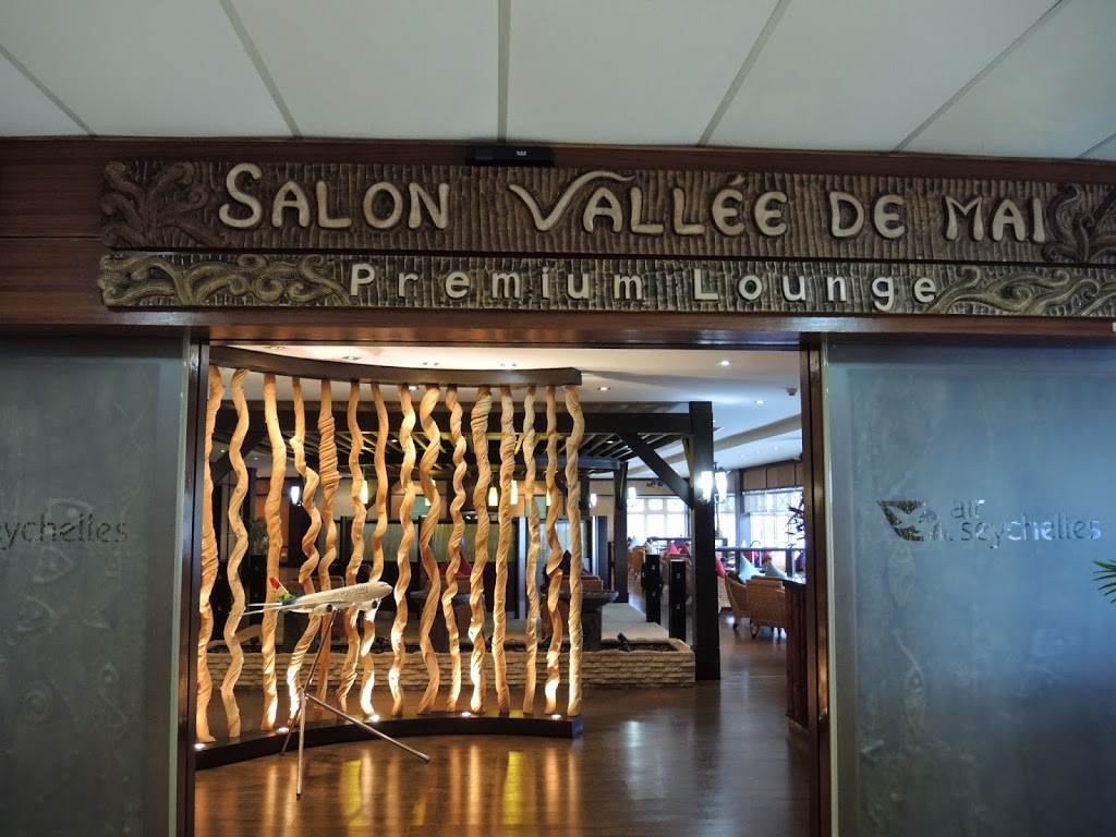 a sign with a wooden curtain