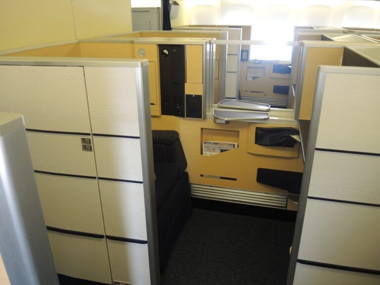 a room with cubicles and a couch