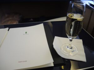 a glass of champagne on a napkin
