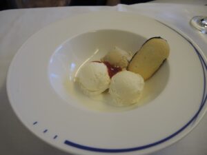 a plate of ice cream and a cookie