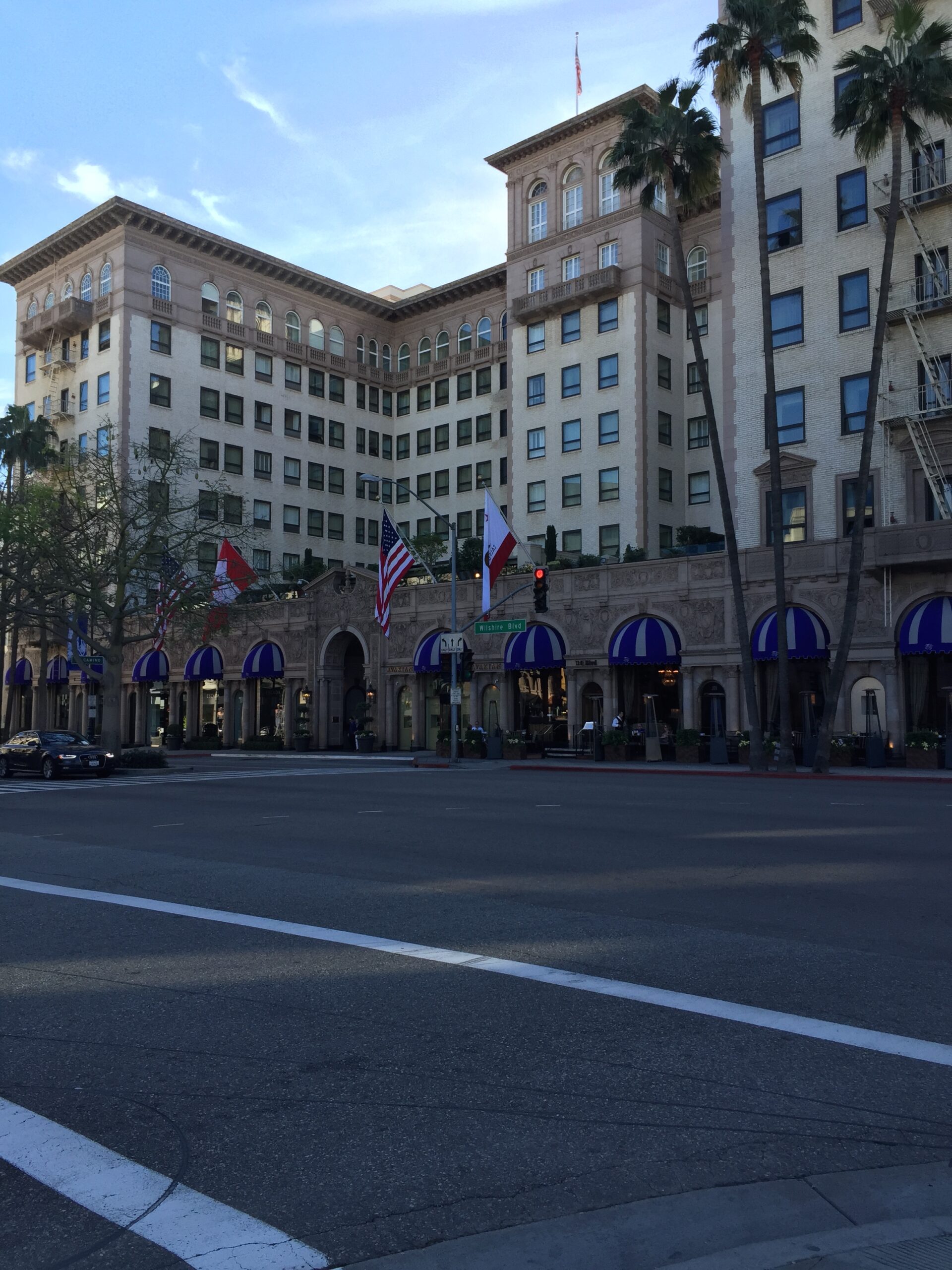 a street with a building and flags