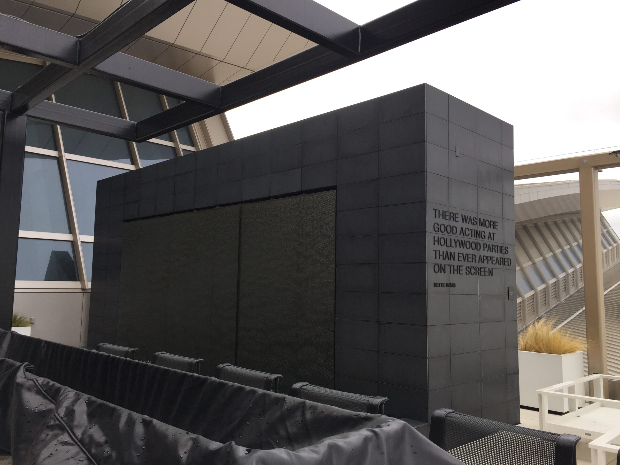 a black rectangular structure with black chairs