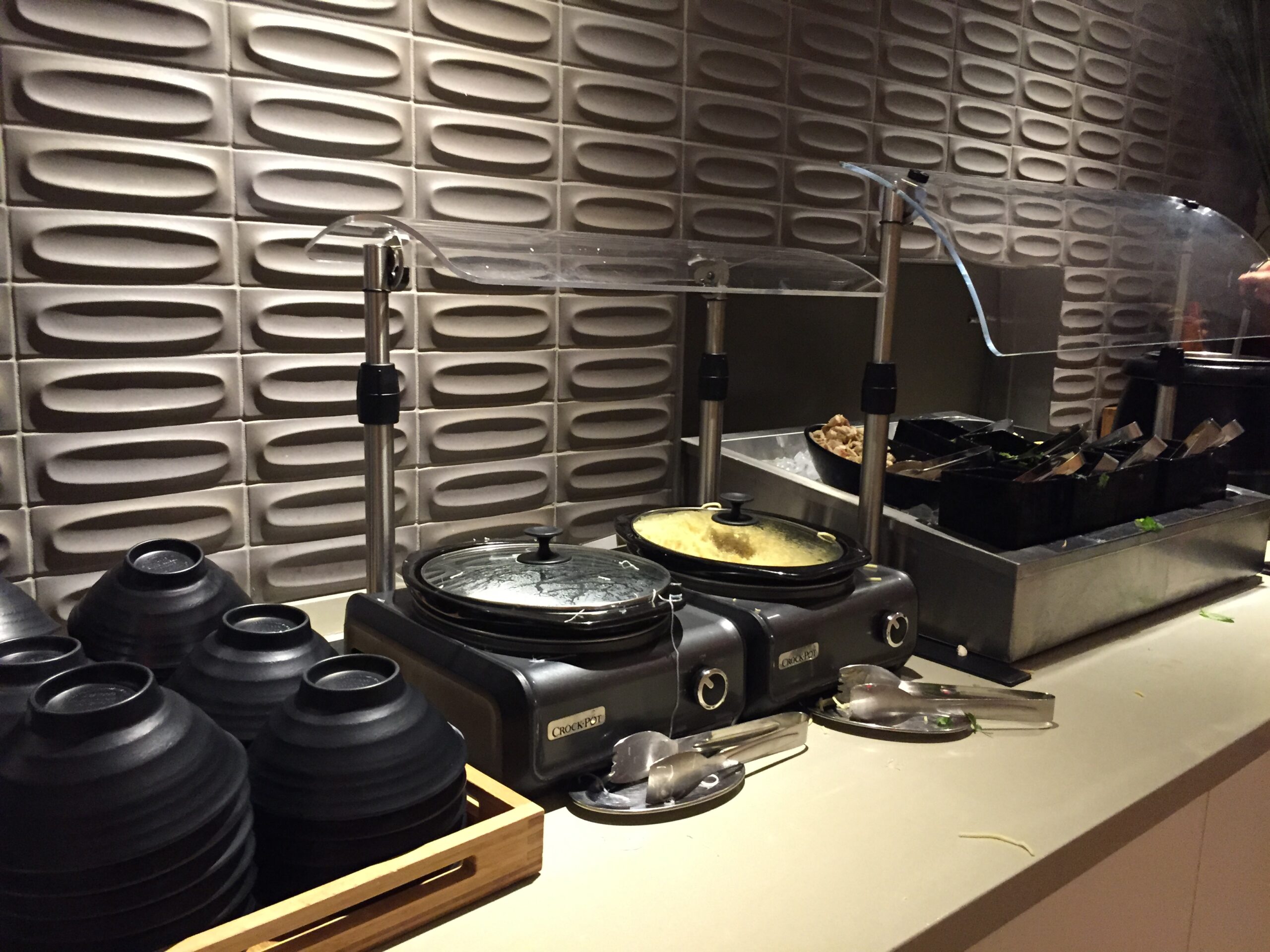 a kitchen counter with a few bowls and a machine