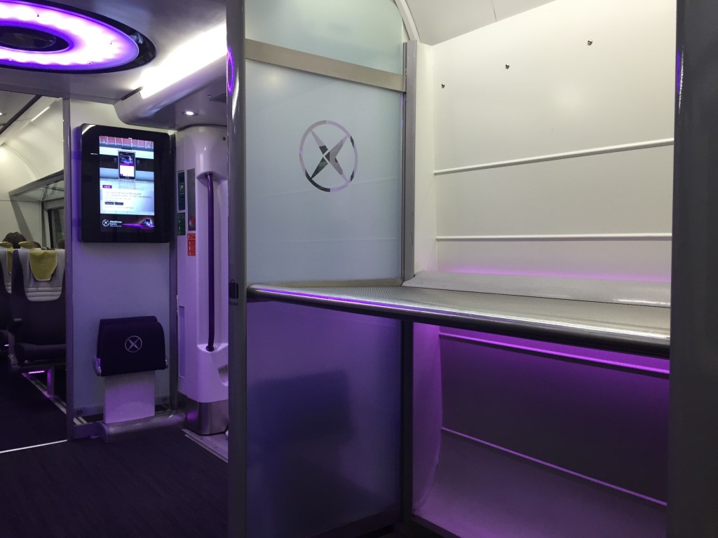 a room with a screen and a television