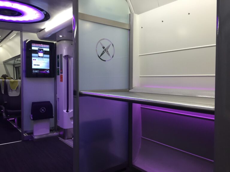 a room with a screen and a toilet