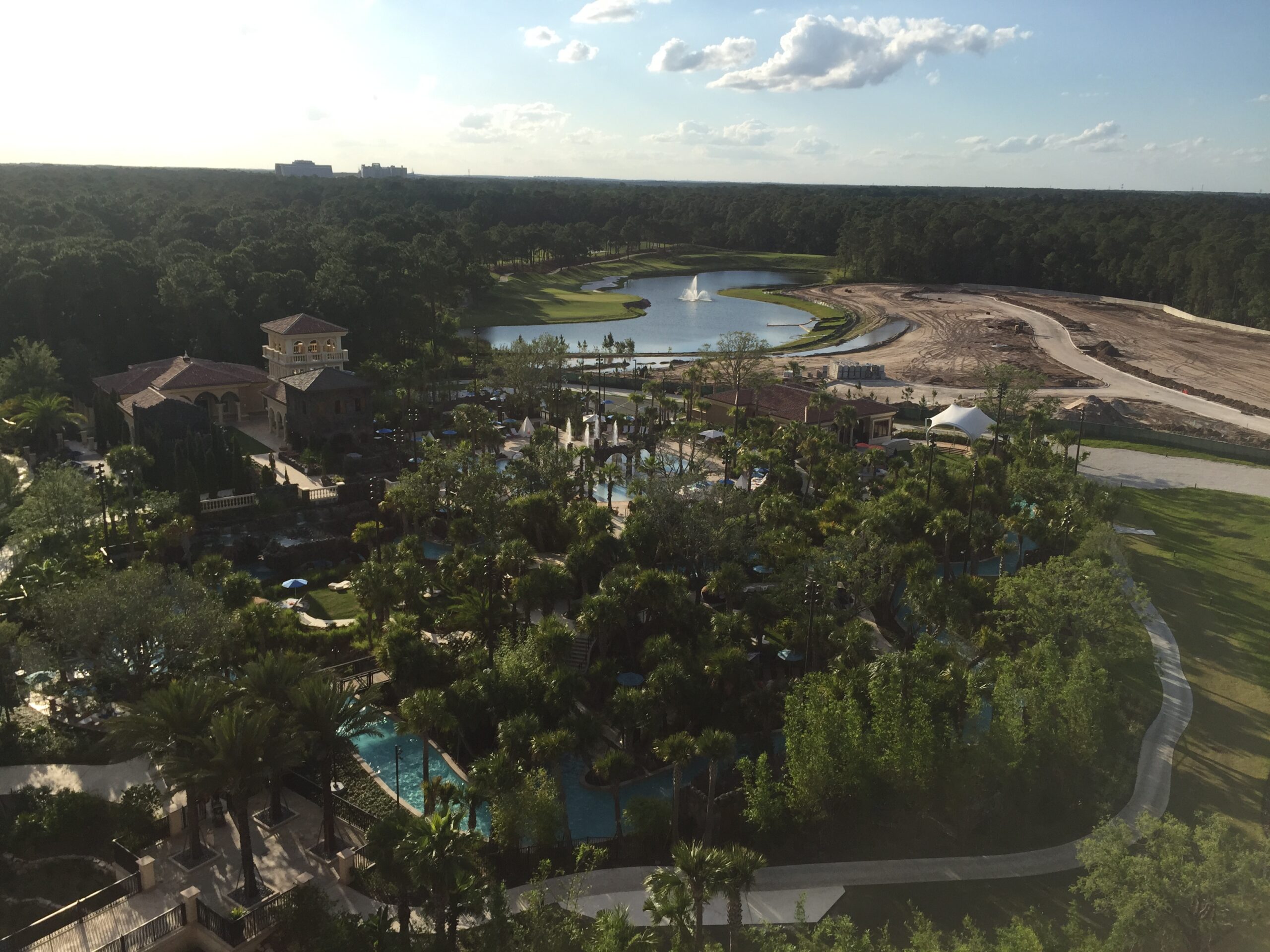a large area with trees and a pool