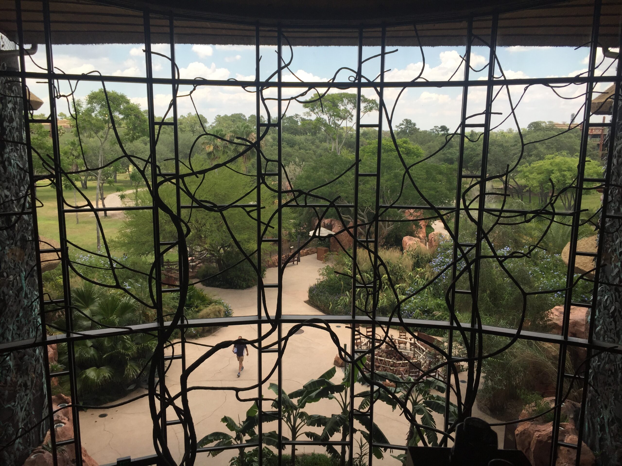 a view of a person walking through a window