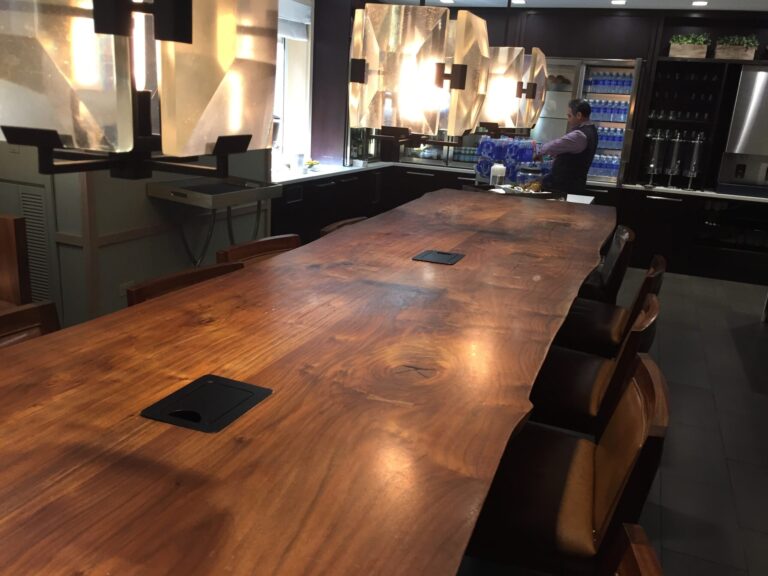 a man standing behind a large table