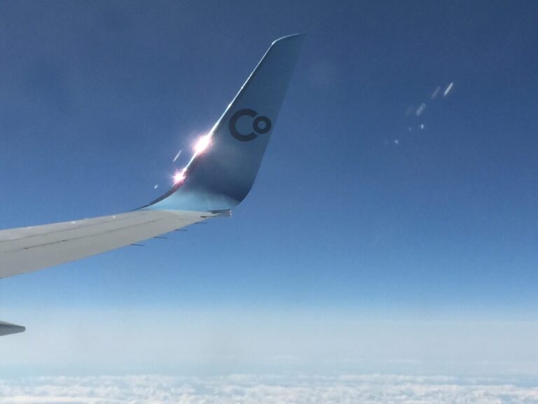 an wing of an airplane in the sky
