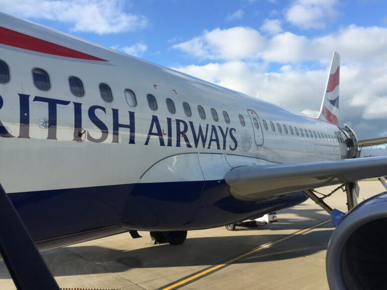 a large airplane with blue and white text on it
