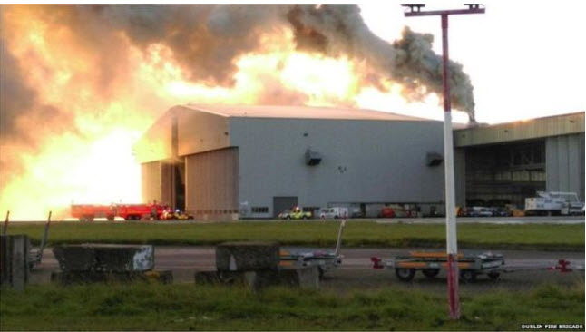 a large building with smoke coming out of it