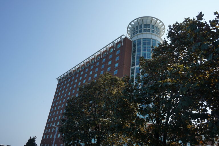 a building with trees in the background