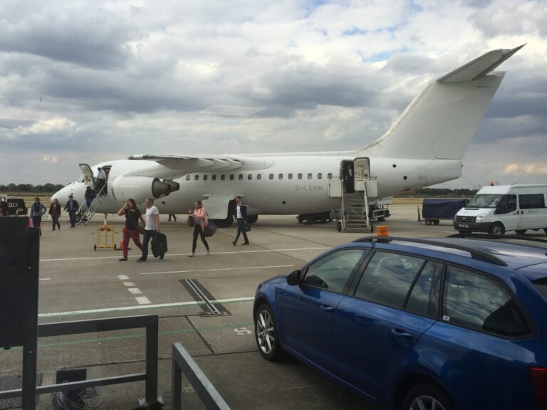 people boarding a plane at an airport