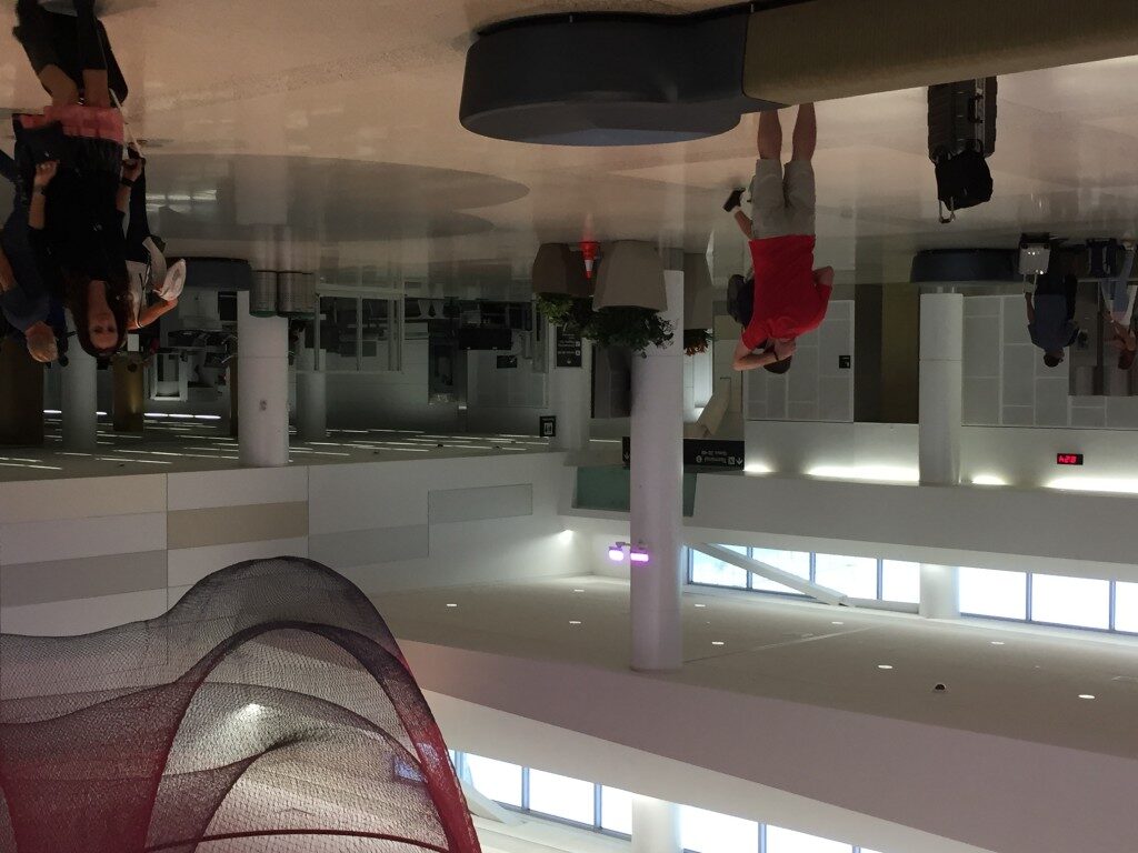 a man climbing on a wall in a building