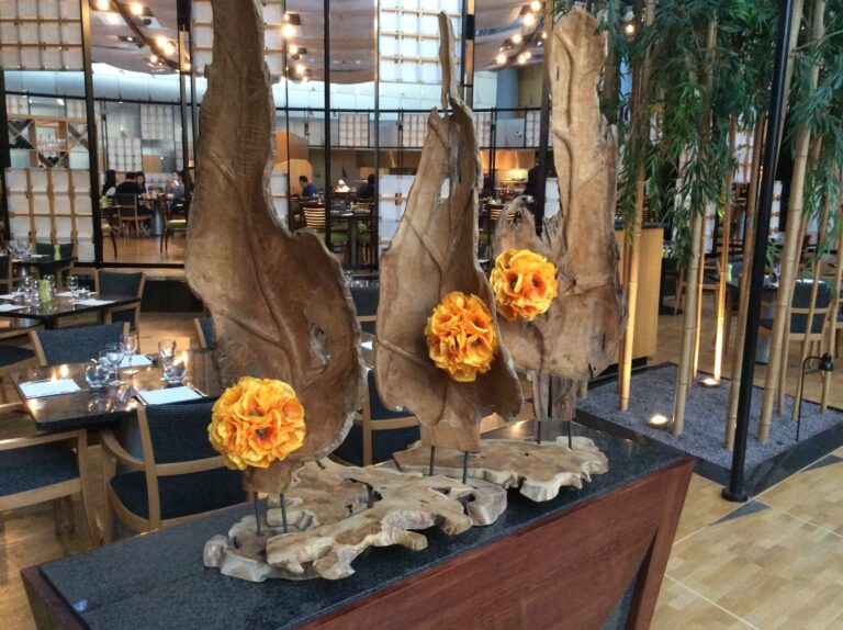 a group of wood pieces with flowers on top