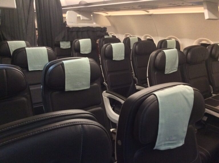 a row of seats with towels on them