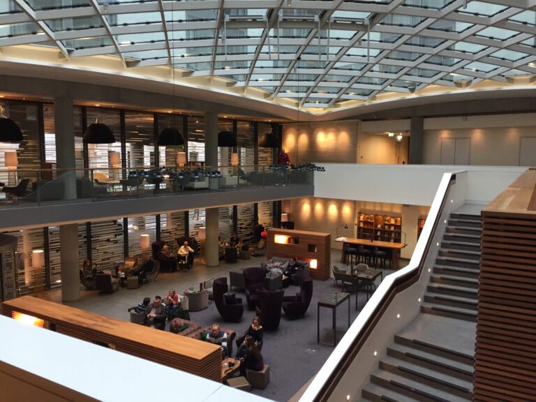 a large building with a glass ceiling and a large staircase