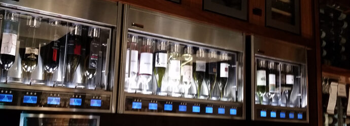 a group of bottles of wine in a refrigerator