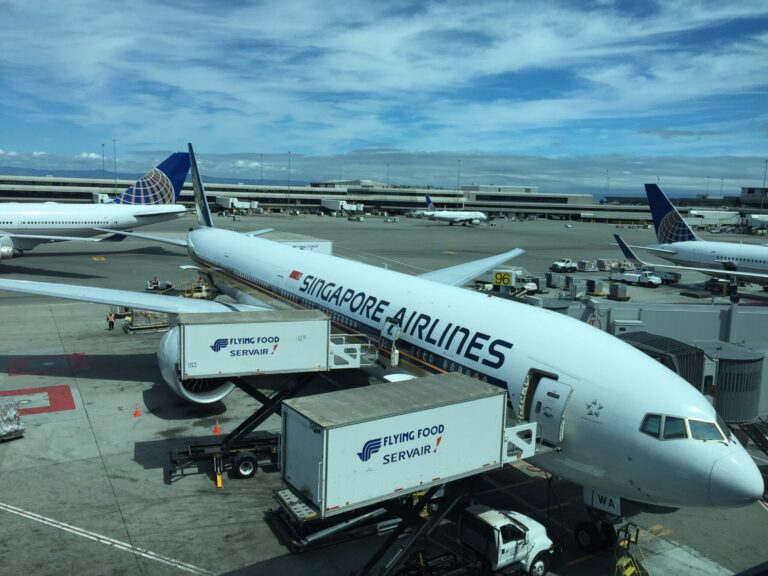 a group of airplanes at an airport