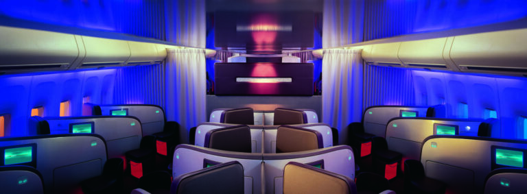 a room with chairs and a screen