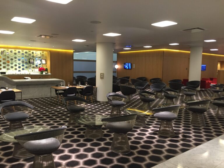 a room with chairs and tables