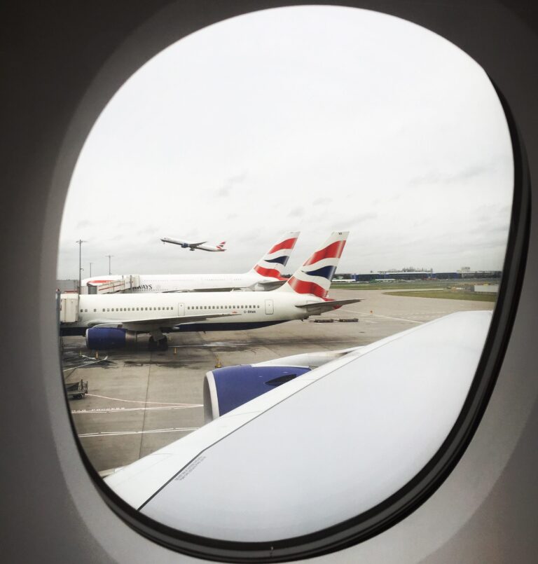 a plane in the window of an airplane