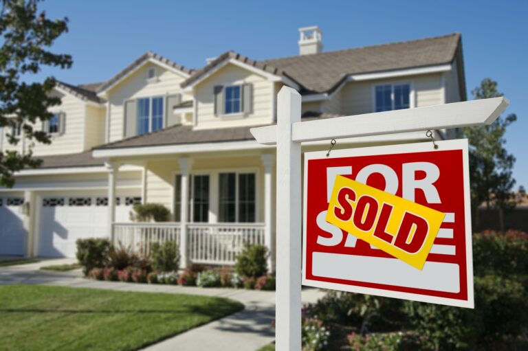 a house with a sold sign