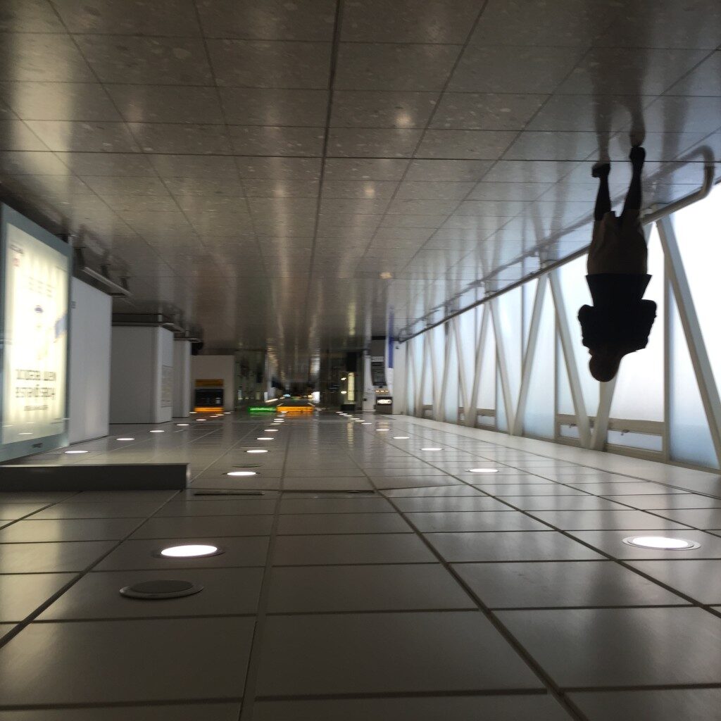 a person from the ceiling of a building