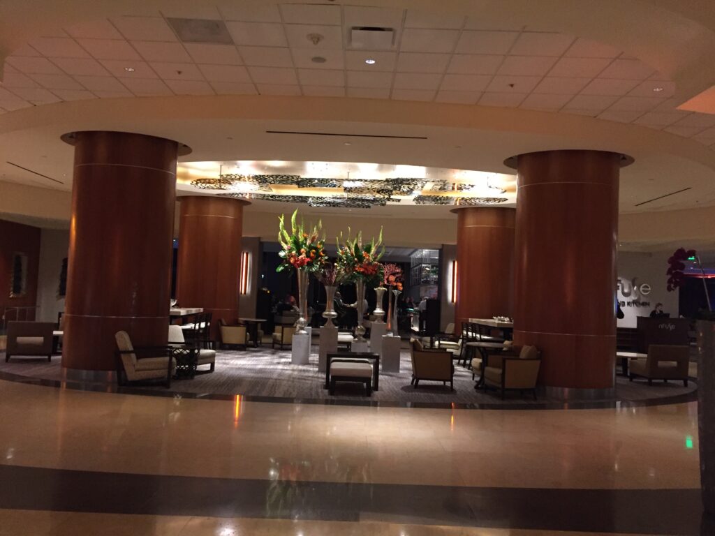 a lobby with chairs and tables