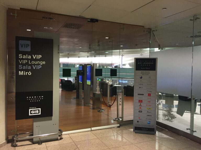 a glass door with signs and a sign in front of a glass wall