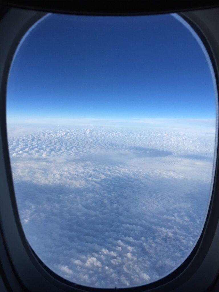 a view of clouds from an airplane window