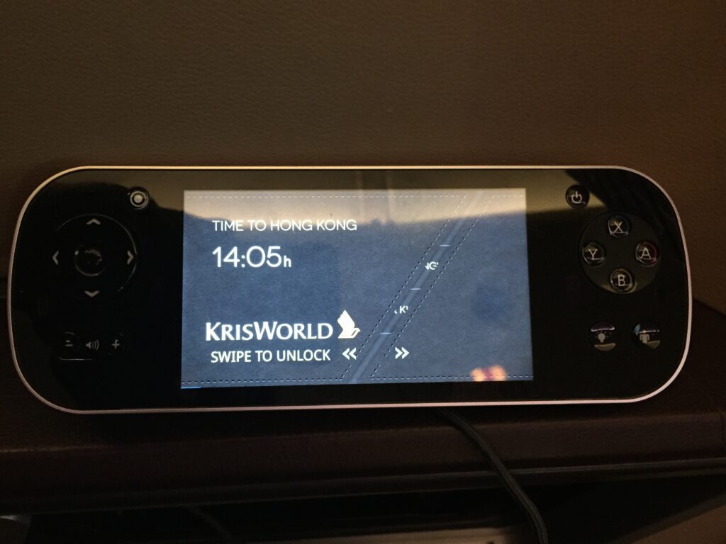 singapore airlines first class san francisco to hong kong handheld control