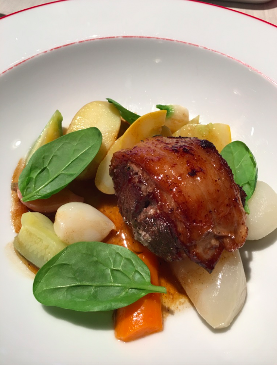 a plate of food on a white surface