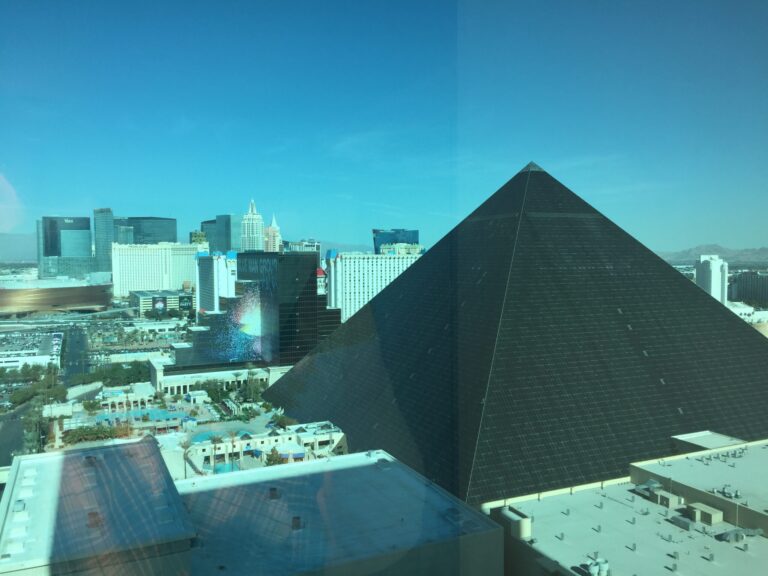 a pyramid shaped building in a city