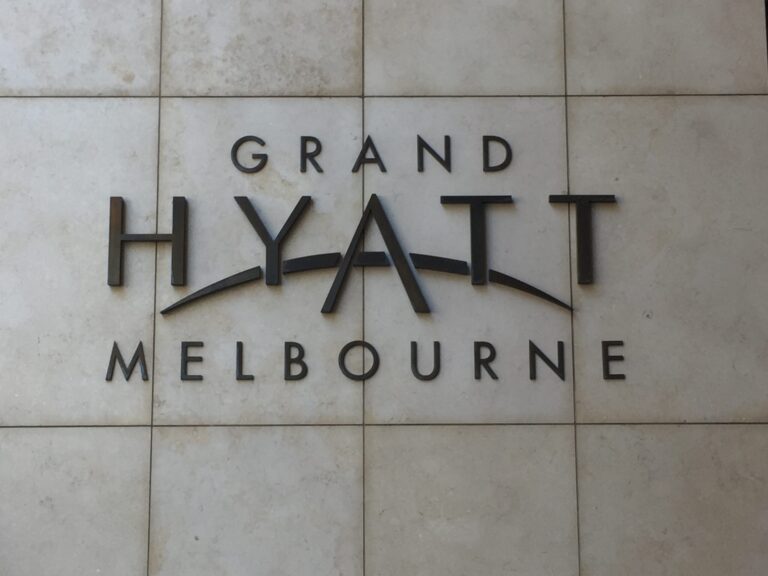 a sign on a tile wall
