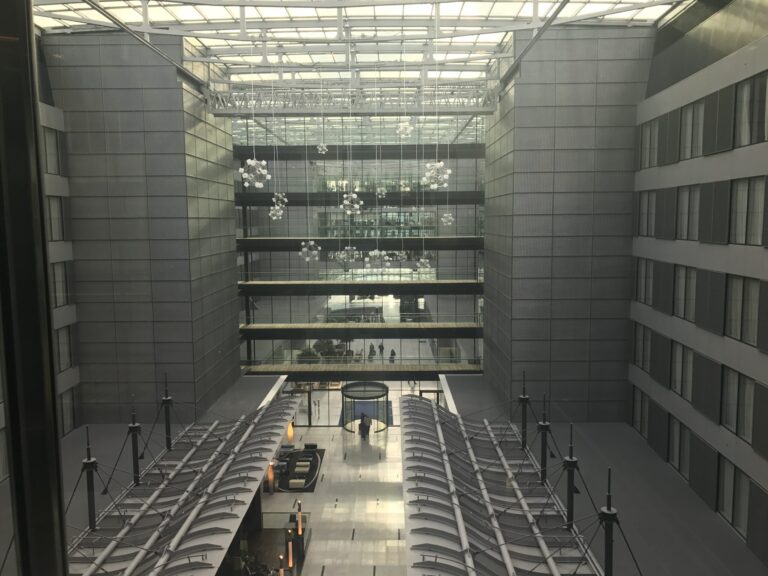 a building with glass walls and a glass ceiling