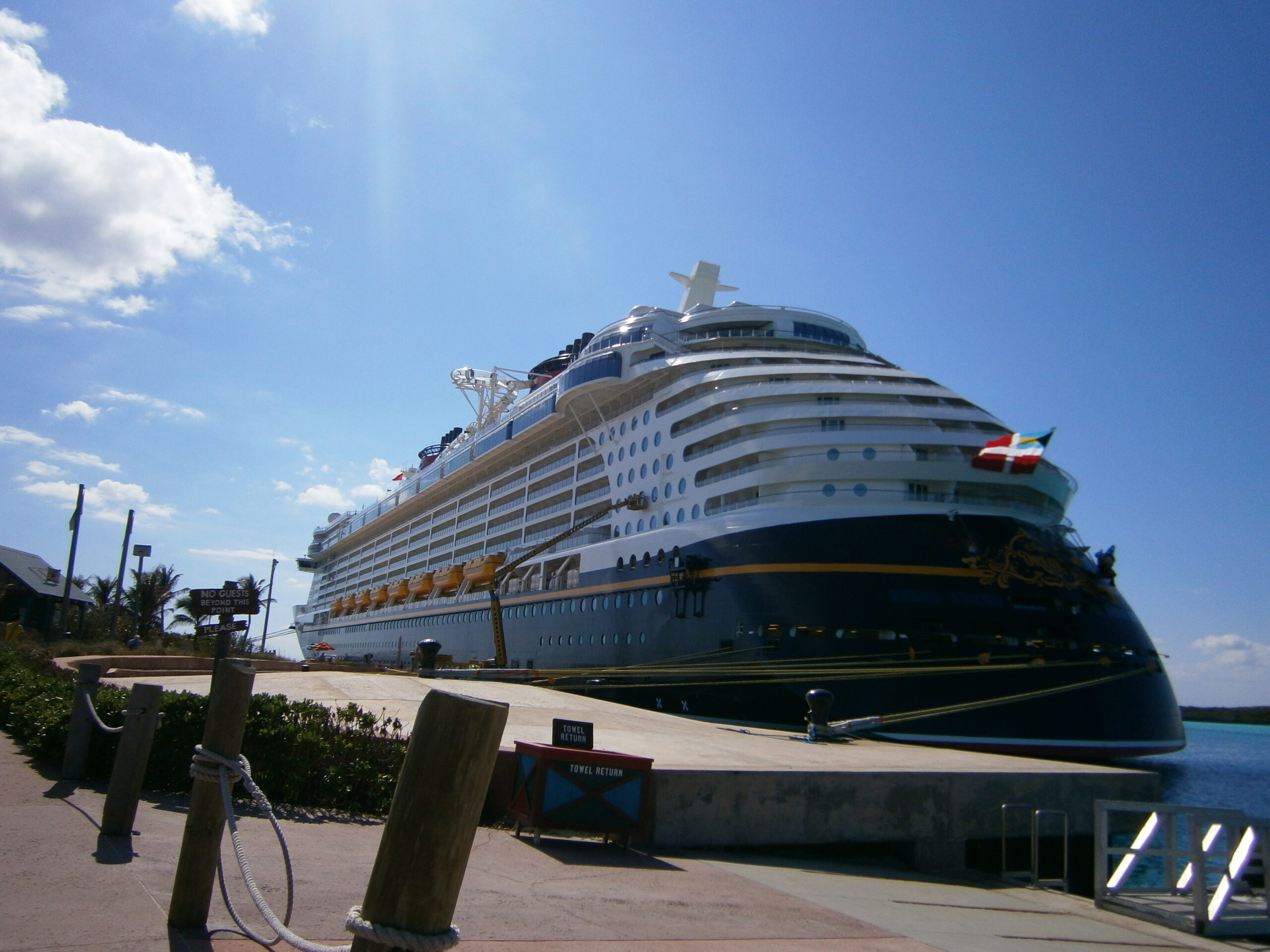 a large cruise ship docked at a dock