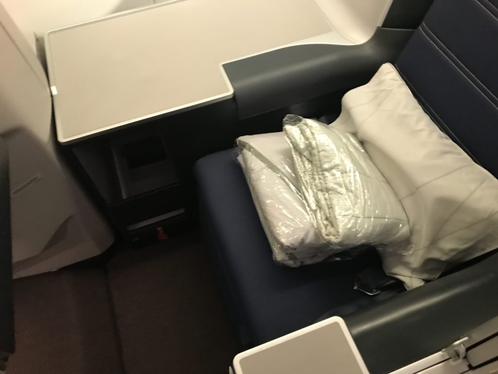 a white pillow on a chair