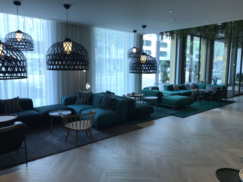 a room with a couch and chairs