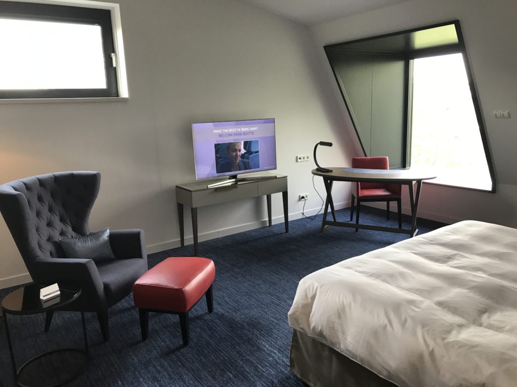 a room with a television and a bed
