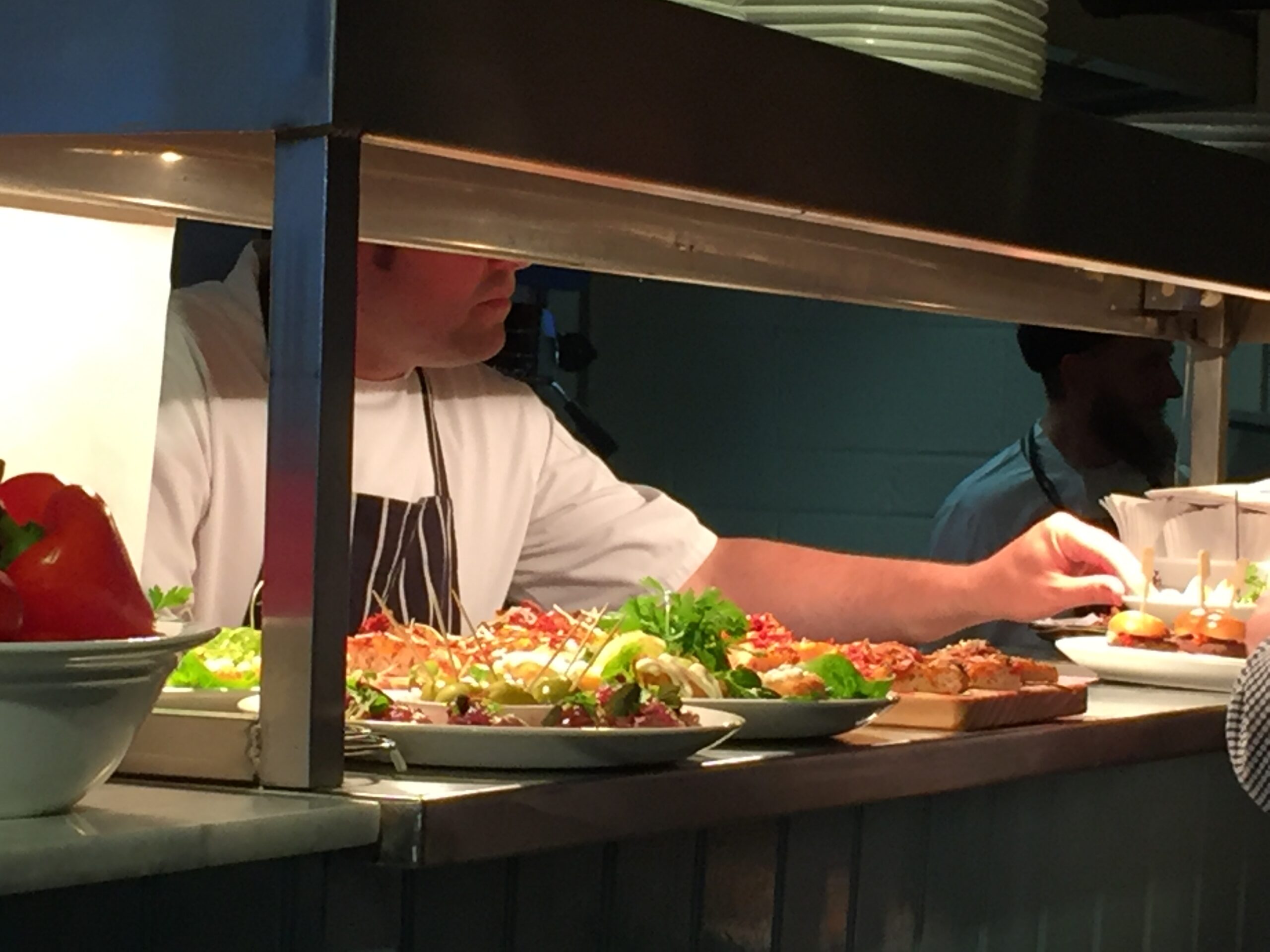 a man in a chef's uniform in a kitchen