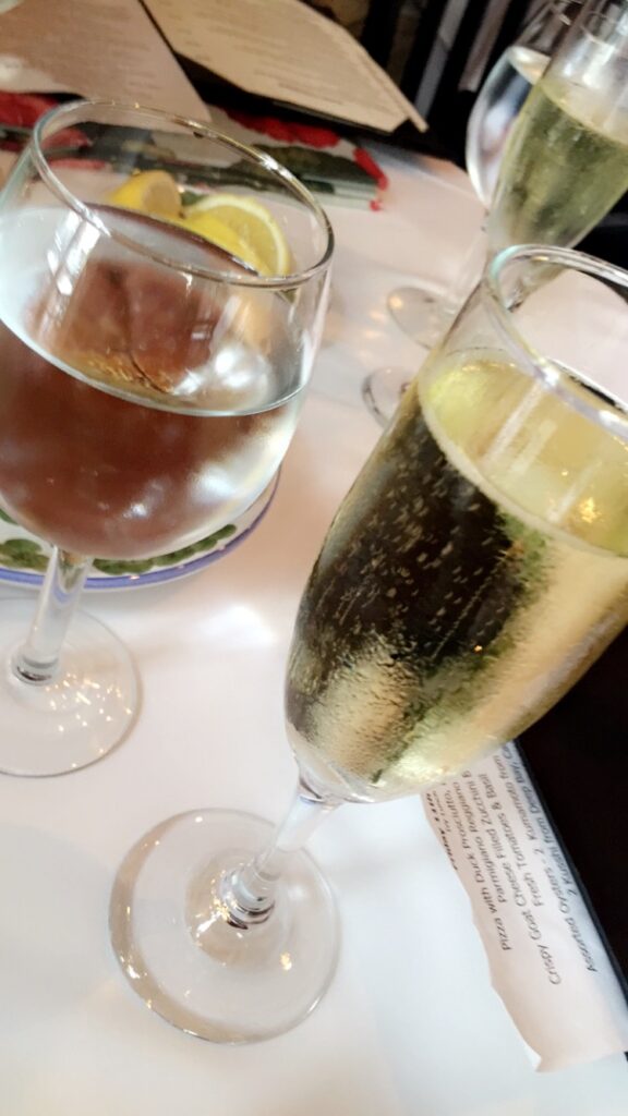 a couple of wine glasses on a table