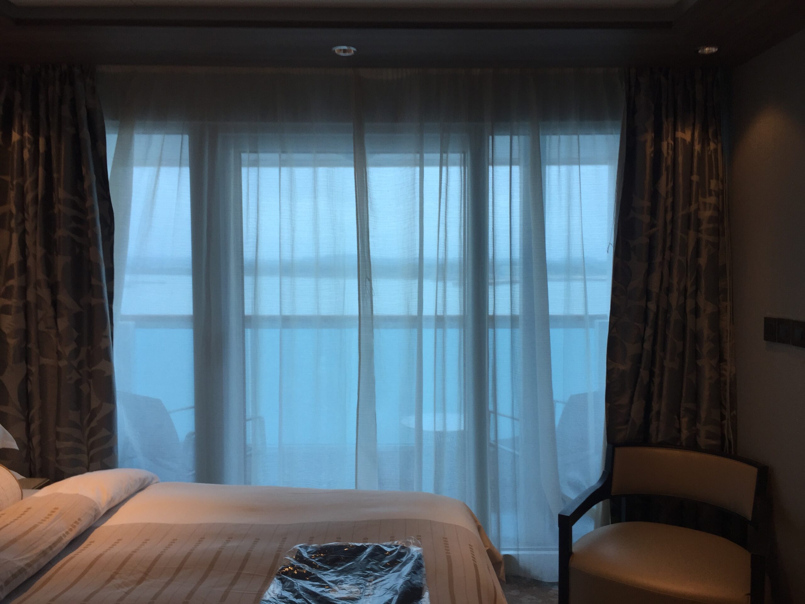 a bed in a room with curtains
