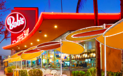 a restaurant with a red sign
