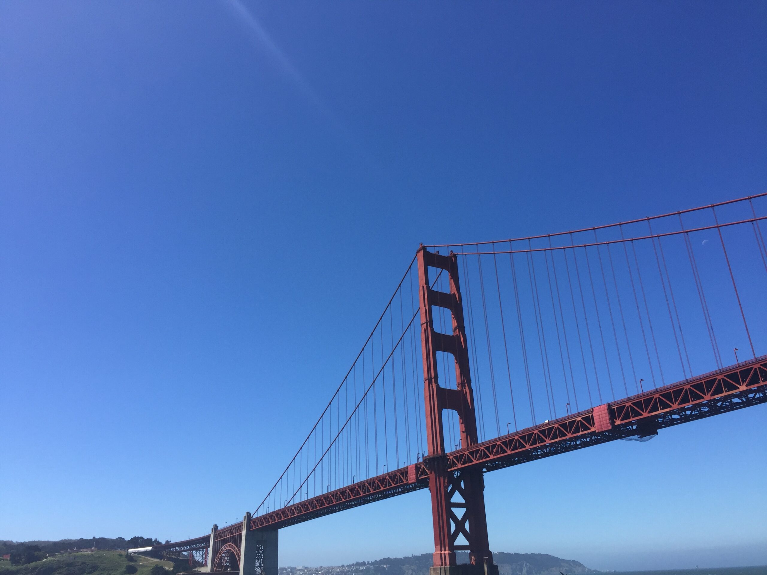a bridge over water with a blue sky