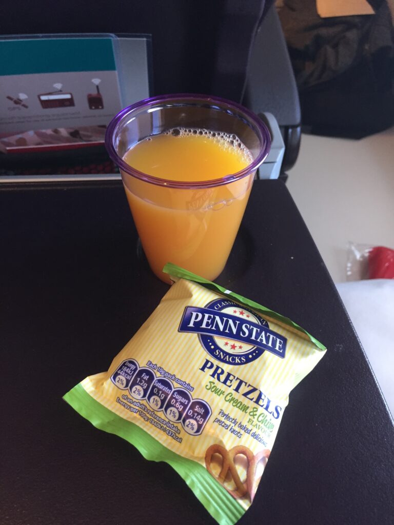 a drink and a bag of pretzels